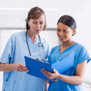 Nurse leader coaching a staff member Nurse leader coaching a staff member