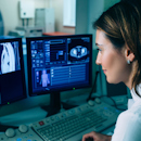 Radiologic technologists reviewing scans Radiologic technologists reviewing scans