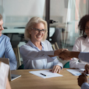 Senior nursing leader shaking hands with a colleague Senior nursing leader shaking hands with a colleague
